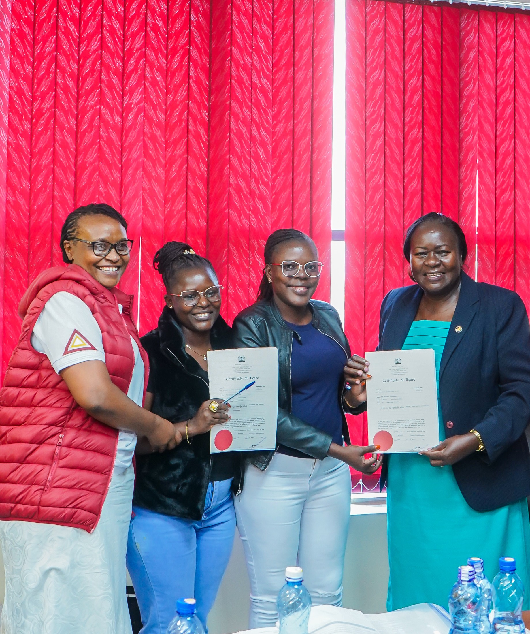 Members Receiving Title Deeds