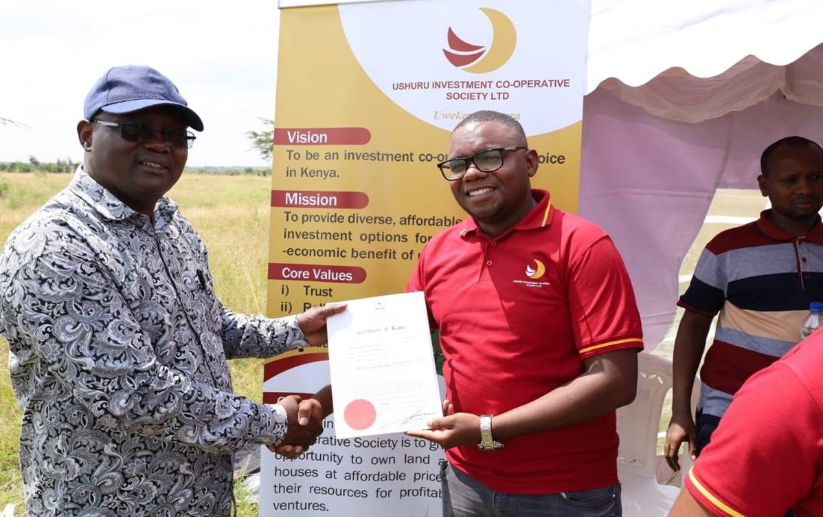 Members Receiving Title Deeds